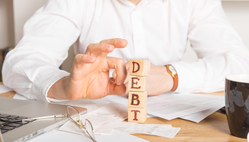Diferencia entre debt settlement y debt management